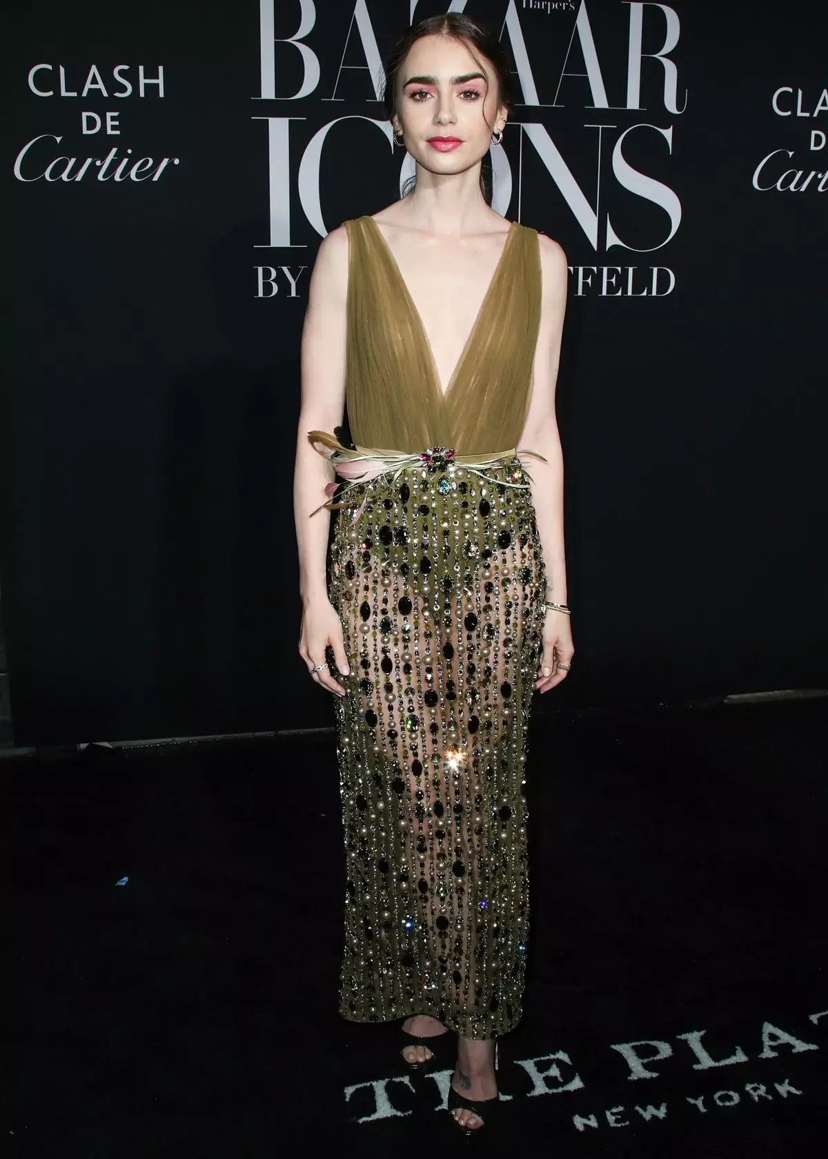 Lily Collins in a Georges Hobeika Fall 2019 Couture dress and Jimmy Choo Pattie platform sandals arrives at the 2019 Harper's BAZAAR Celebration of 'ICONS By Carine Roitfeld' held at The Plaza Hotel on September 6, 2019, in Manhattan, New York City