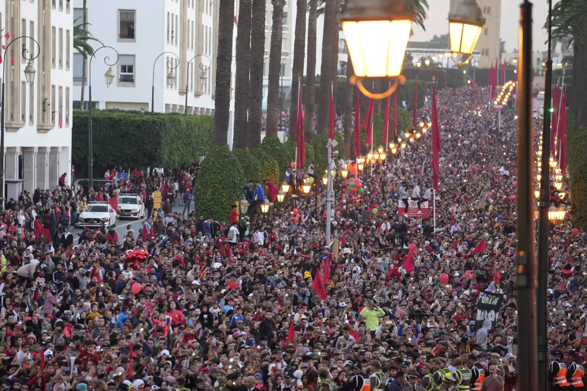 Fans celebrate during a homecoming parade for Morocco national football team in central Rabat