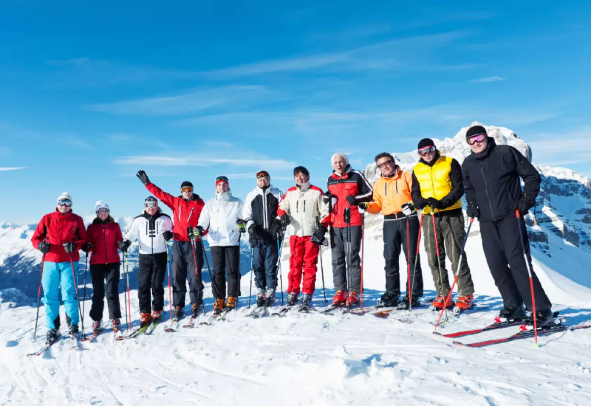 Best group travel insurance large group of people skiing