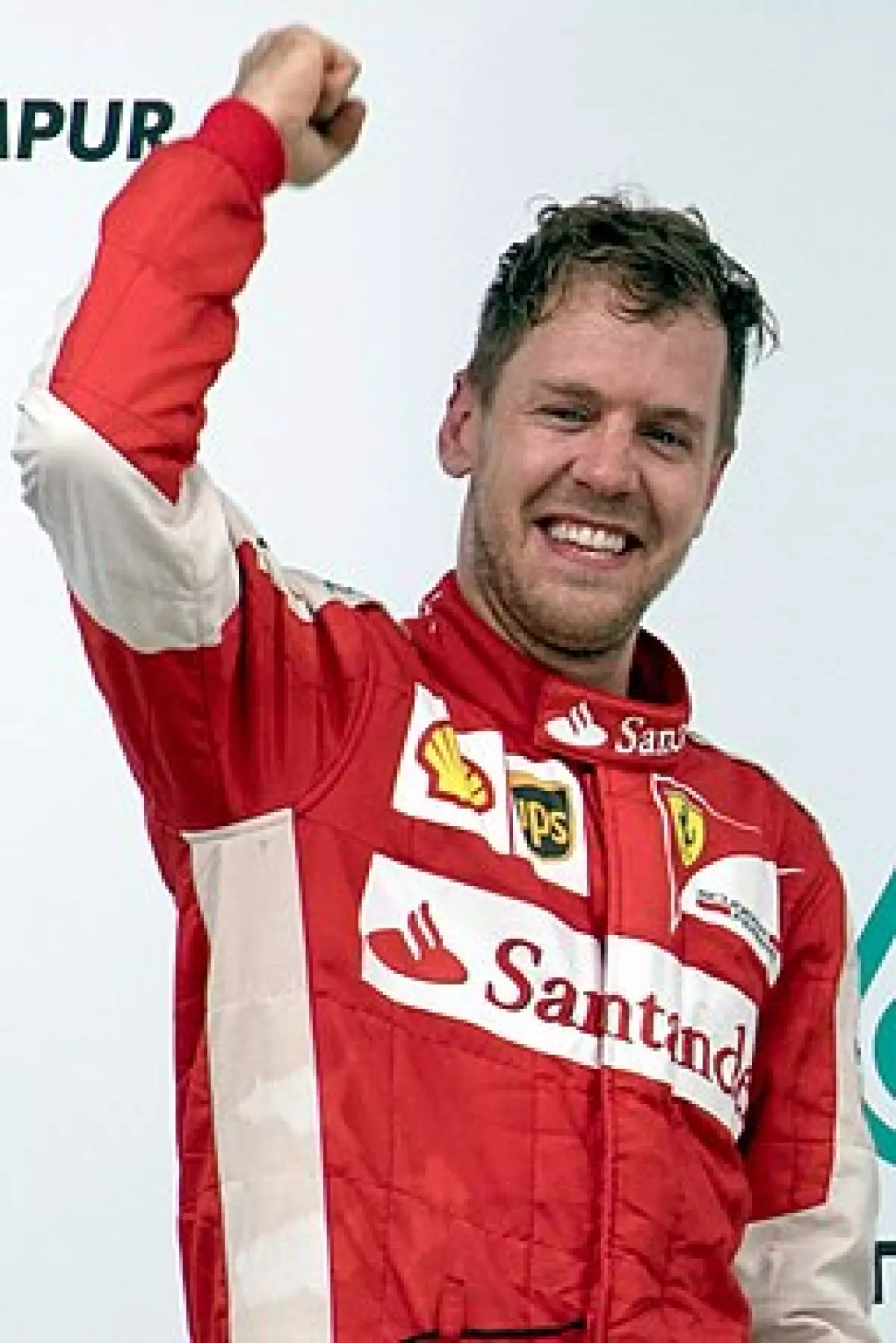 Sebastian Vettel celebrating his victory at the 2015 Malaysian Grand Prix, his first for the Ferrari team.