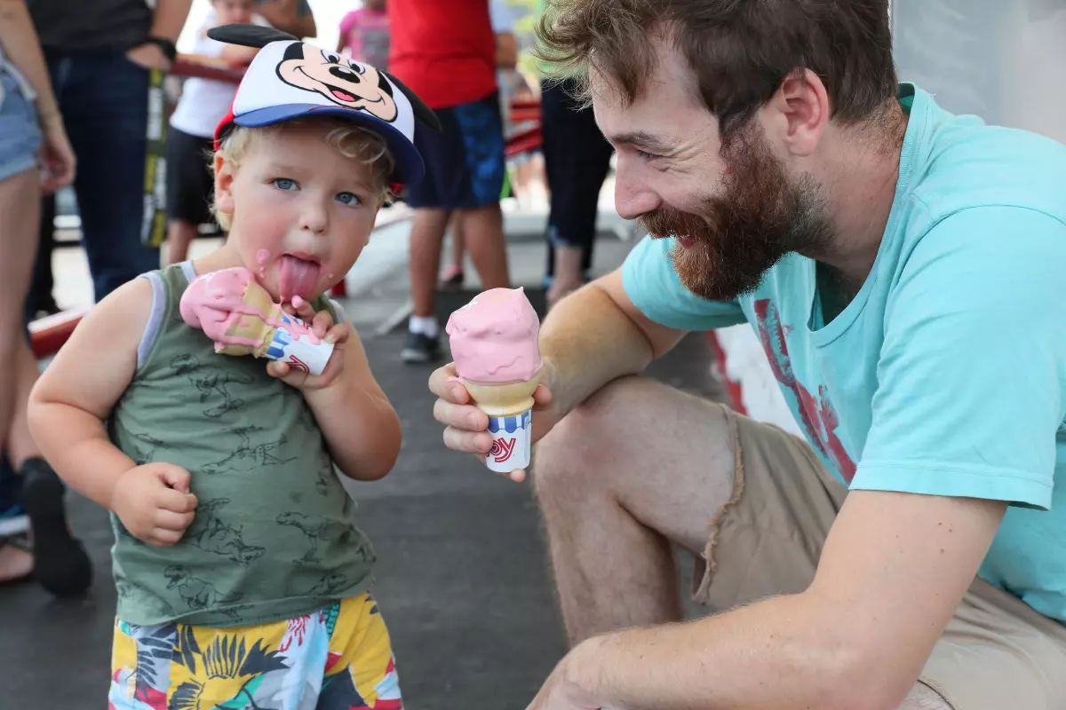 At Leon’s Frozen Custard, Fin McGonegle, 2, and his father, Owen McGonegle of Milwaukee, enjoy their frozen custard on a hot summer afternoon.