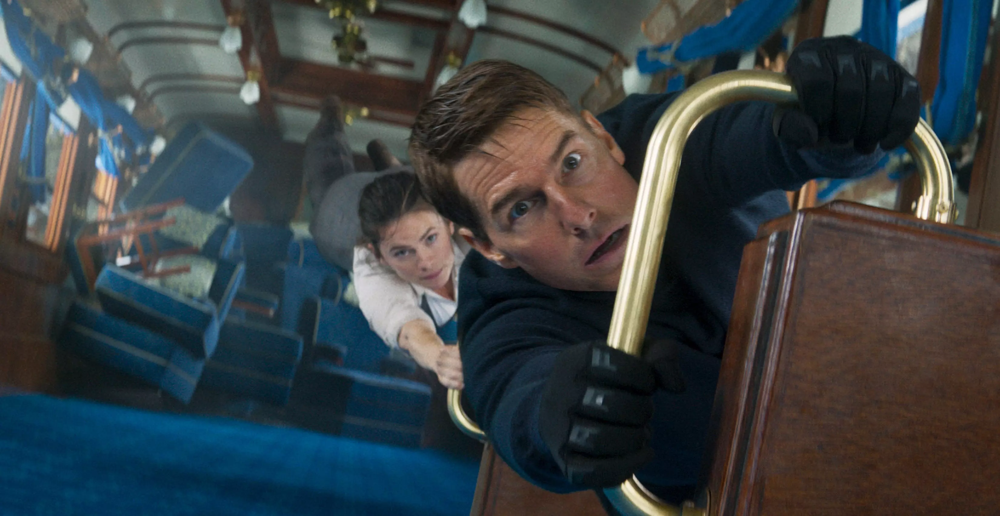 Secret agent Ethan Hunt (Tom Cruise) and the mysterious thief Grace (Hayley Atwell) try to survive a trip on the Orient Express in the action movie "Mission: Impossible - Dead Reckoning Part One."