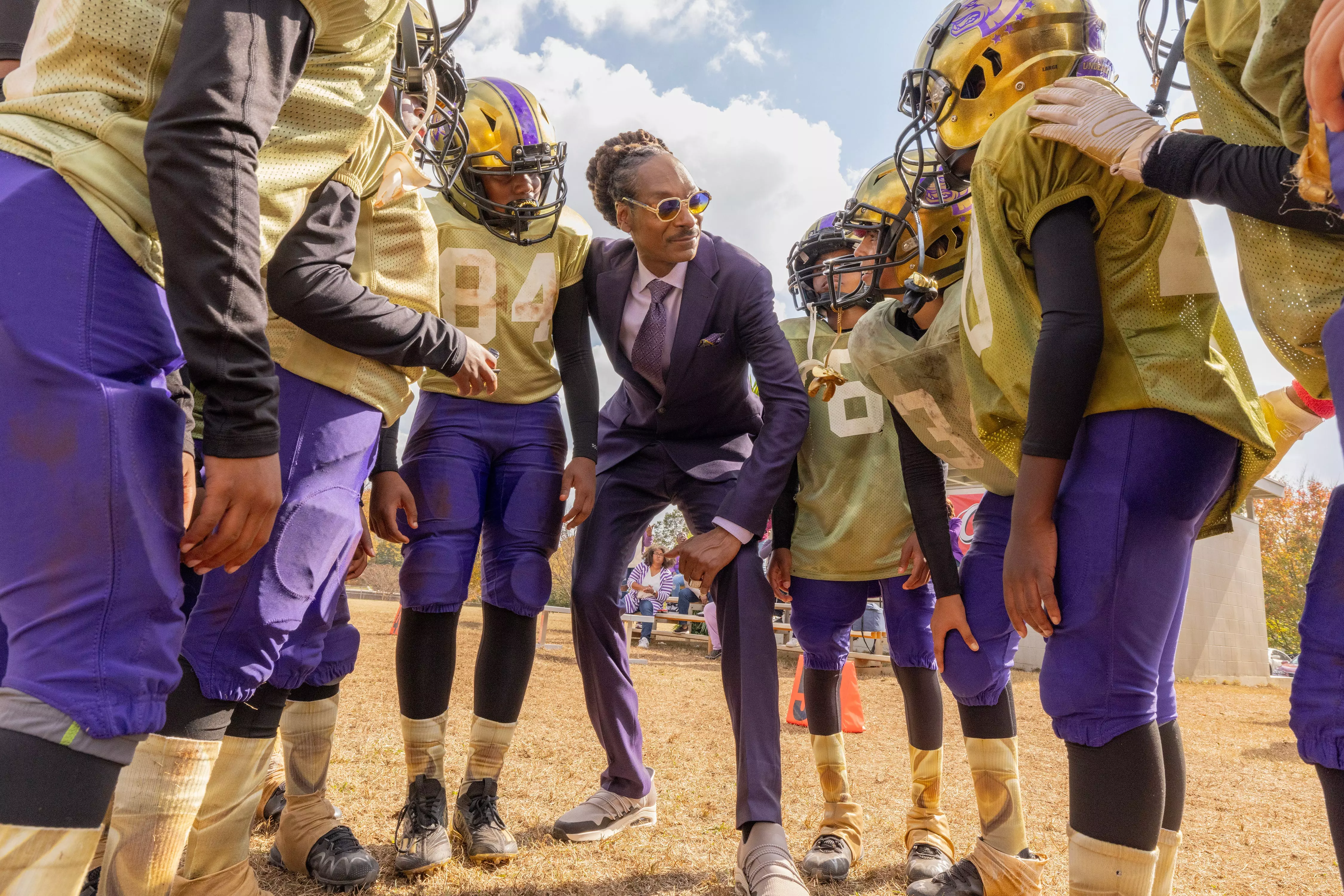 Snoop Dogg (center) stars as a self-centered former pro who reluctantly takes on coaching duties for a kids' team in 