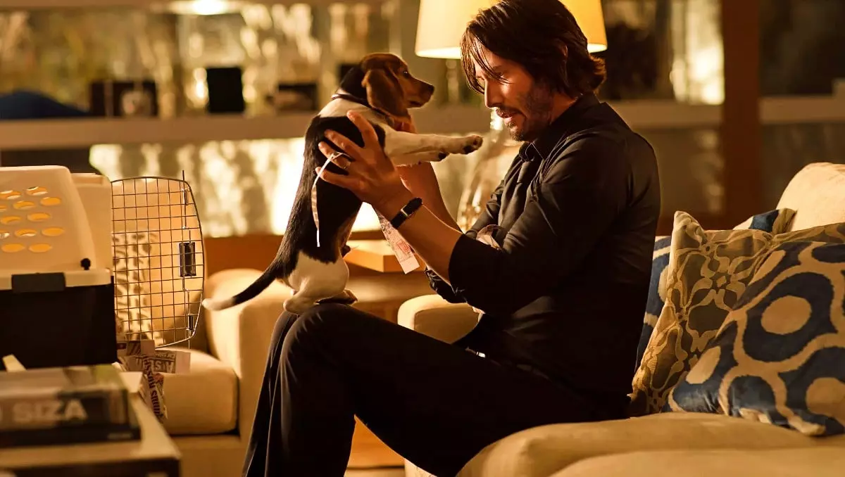 Keanu Reeves as John Wick in the first 2014 movie with his puppy