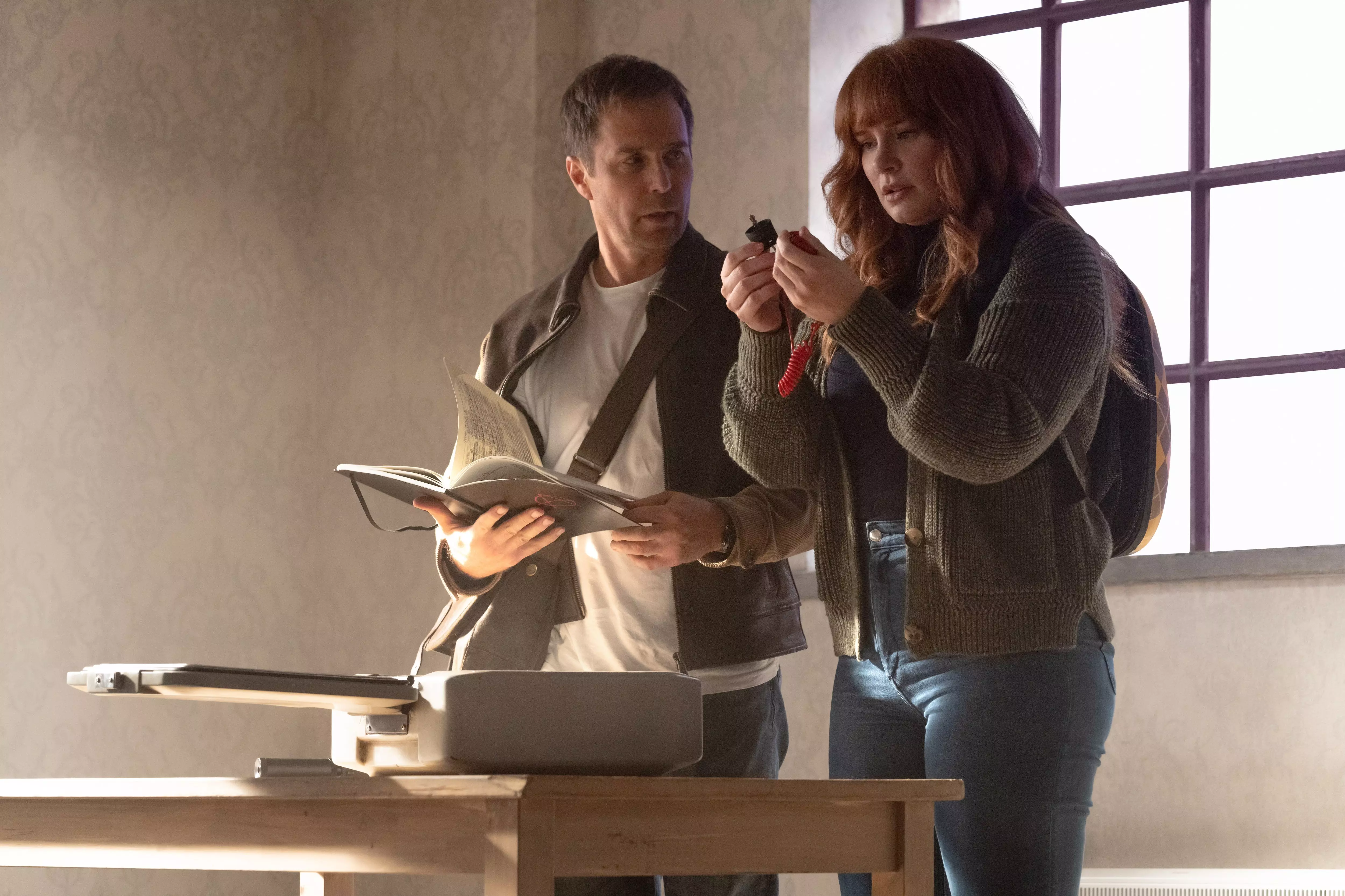 Aidan (Sam Rockwell) works to keep spy novelist Elly Conway (Bryce Dallas Howard) safe from the shadowy Division in "Argylle."