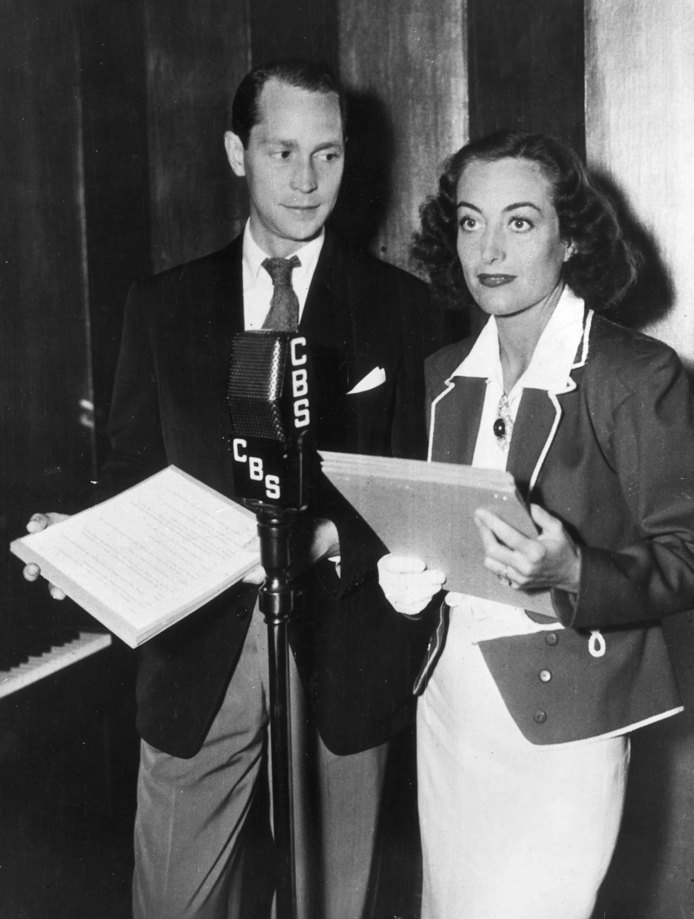 Joan Crawford and her second husband Franchot Tone recording a radio show for CBS.